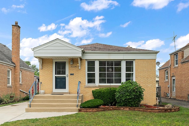 3334 W 114th St, Chicago, IL 60655 - view of front of home with brick siding and a front lawn