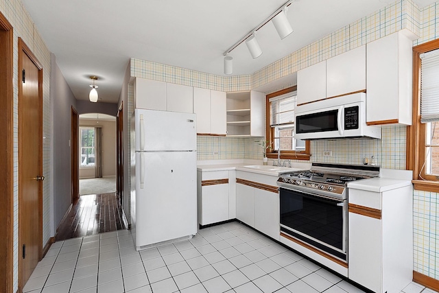3334 W 114th St, Chicago, IL 60655 - kitchen with white appliances, open shelves, light countertops, white cabinets, and tasteful backsplash
