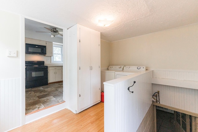 620 Elm St, Maple Park, IL 60151 - laundry area with independent washer and dryer, light wood-type flooring, a wainscoted wall, a ceiling fan, and a textured ceiling