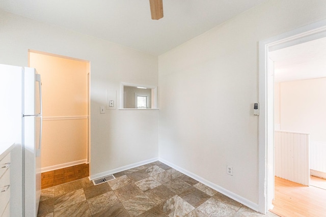 620 Elm St, Maple Park, IL 60151 - spare room featuring a ceiling fan and stone finish floors