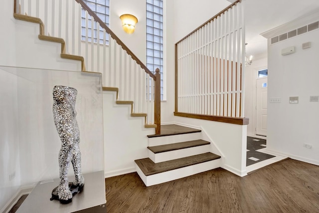 826 S Bell Ave, Chicago, IL 60612 - stairway with wood finished floors and a chandelier