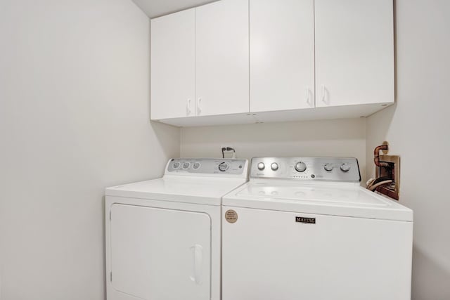 826 S Bell Ave, Chicago, IL 60612 - laundry room with cabinet space and washer and dryer