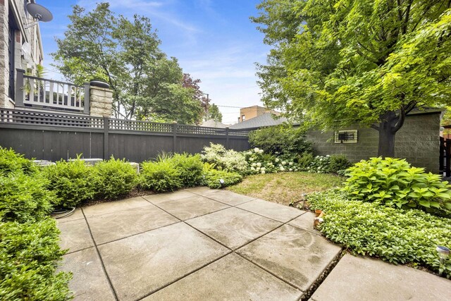 826 S Bell Ave, Chicago, IL 60612 - fenced backyard featuring a patio