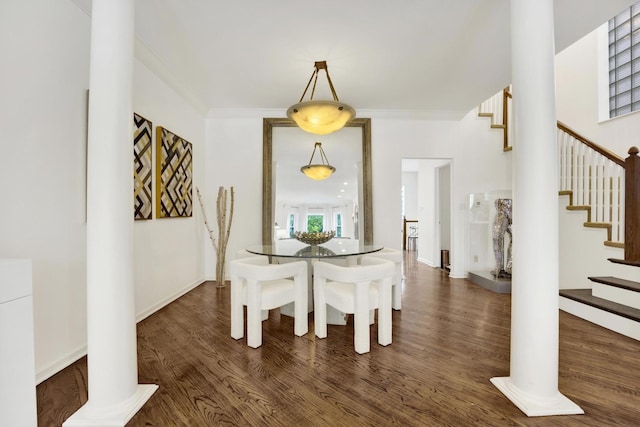 826 S Bell Ave, Chicago, IL 60612 - dining area featuring dark wood finished floors, stairway, crown molding, and decorative columns