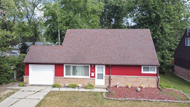 109 Walnut St, Park Forest, IL 60466 - view of front of property featuring brick siding, driveway, an attached garage, and a front yard