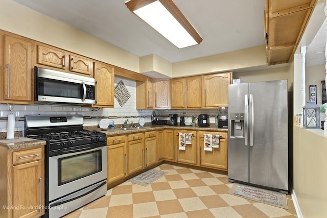 109 Walnut St, Park Forest, IL 60466 - kitchen featuring appliances with stainless steel finishes, light floors, and backsplash