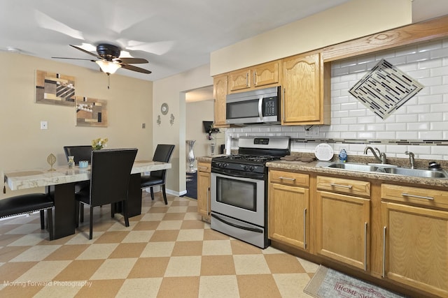 109 Walnut St, Park Forest, IL 60466 - kitchen featuring appliances with stainless steel finishes, light flooring, tasteful backsplash, and ceiling fan