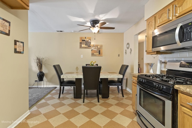 109 Walnut St, Park Forest, IL 60466 - kitchen featuring appliances with stainless steel finishes, light flooring, ceiling fan, light countertops, and backsplash