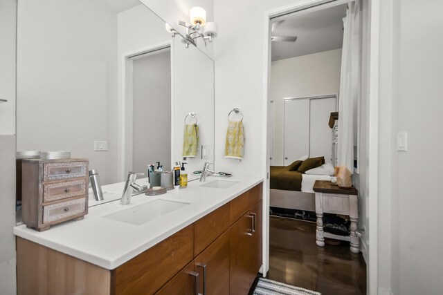 1375 N Milwaukee Ave Unit 2F, Chicago, IL 60622 - bathroom featuring double vanity and wood finished floors