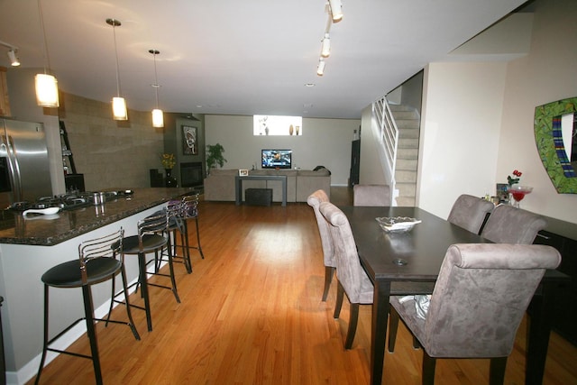 1705 N Clybourn Ave Unit H, Chicago, IL 60614 - dining room featuring stairway, light wood-style floors, and track lighting