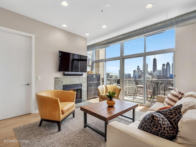 700 N Larrabee St Unit 2008, Chicago, IL 60654 - living room featuring a fireplace, light wood-style flooring, and recessed lighting