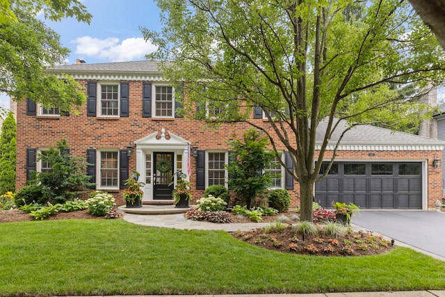 1563 Abbotsford Dr, Naperville, IL 60563 - view of front of home with asphalt driveway, a front yard, an attached garage, and brick siding