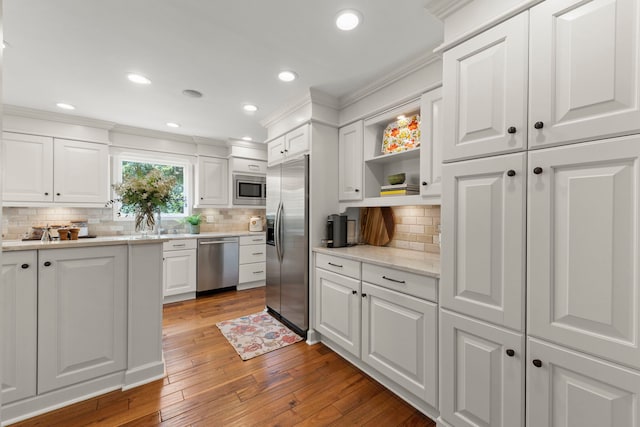1563 Abbotsford Dr, Naperville, IL 60563 - kitchen featuring stainless steel appliances, white cabinetry, open shelves, tasteful backsplash, and ornamental molding