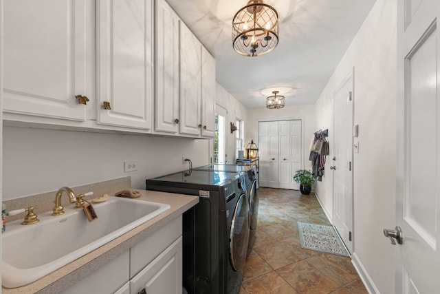 1563 Abbotsford Dr, Naperville, IL 60563 - laundry room with washer and clothes dryer, cabinet space, and a chandelier