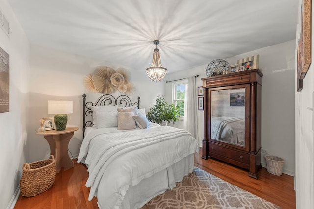 1563 Abbotsford Dr, Naperville, IL 60563 - bedroom with wood finished floors and a chandelier