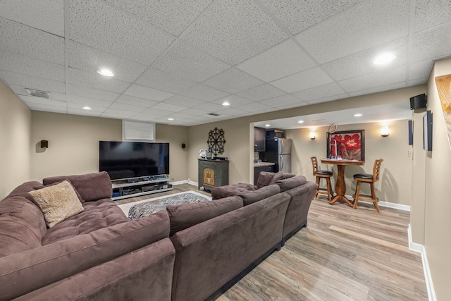 1563 Abbotsford Dr, Naperville, IL 60563 - living room featuring light wood-style floors, a paneled ceiling, and recessed lighting