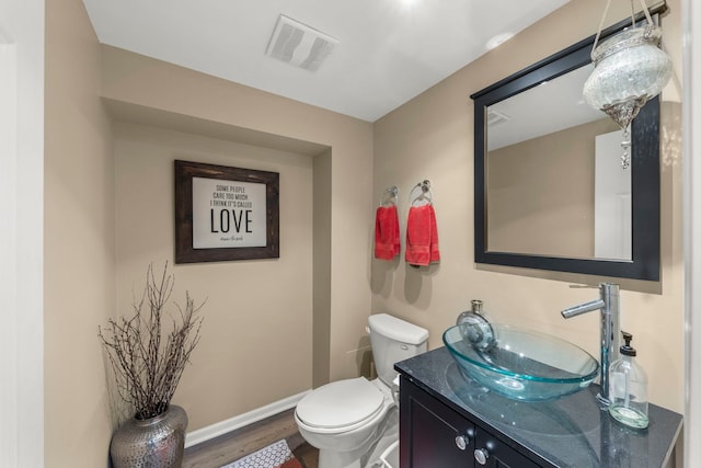 1563 Abbotsford Dr, Naperville, IL 60563 - half bathroom with wood finished floors and vanity