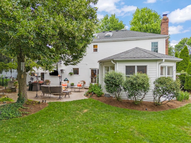1563 Abbotsford Dr, Naperville, IL 60563 - rear view of property with a patio, a chimney, a lawn, and roof with shingles