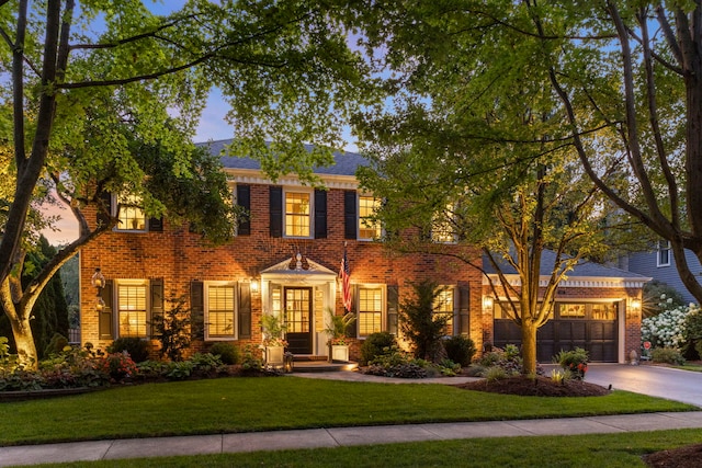 1563 Abbotsford Dr, Naperville, IL 60563 - colonial inspired home featuring concrete driveway, brick siding, a front yard, and an attached garage