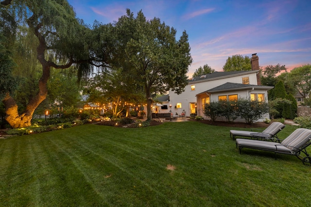 1563 Abbotsford Dr, Naperville, IL 60563 - yard at dusk featuring a yard and a patio