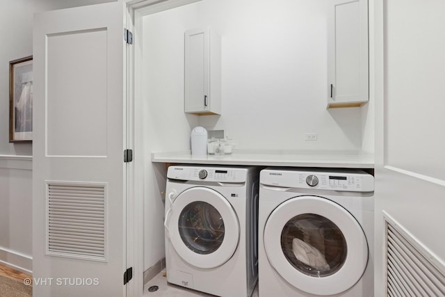 4321 N Paulina St Unit 2N, Chicago, IL 60613 - laundry room featuring cabinet space and separate washer and dryer