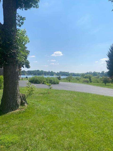 2 Spinnaker Ct, Third Lake, IL 60030 - view of grassy yard featuring a water view