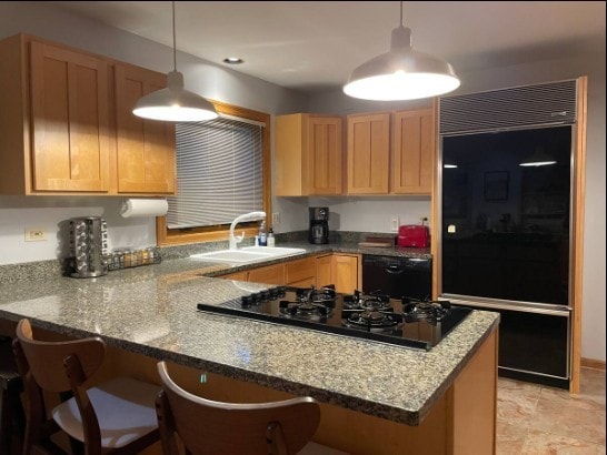 2 Spinnaker Ct, Third Lake, IL 60030 - kitchen with black appliances, a peninsula, a kitchen breakfast bar, light brown cabinetry, and dark stone counters