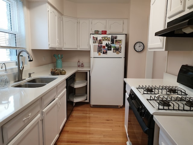kitchen featuring white appliances, under cabinet range hood, white cabinets, and light countertops