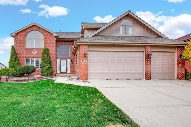 21222 Vivienne Dr, Matteson, IL 60443 - traditional-style house featuring an attached garage, concrete driveway, brick siding, a front yard, and roof with shingles