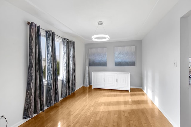 21222 Vivienne Dr, Matteson, IL 60443 - unfurnished dining area with light wood finished floors and baseboards