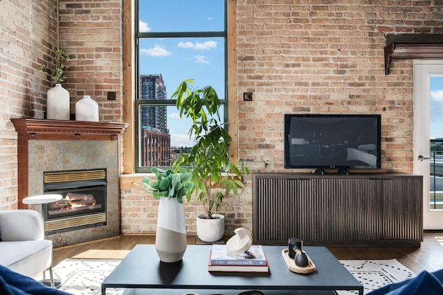 1801 S Michigan Ave Unit 507, Chicago, IL 60616 - living room featuring a glass covered fireplace, wood finished floors, and brick wall