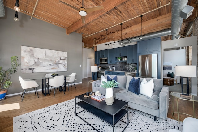 1801 S Michigan Ave Unit 507, Chicago, IL 60616 - living room with rail lighting, a wooden ceiling with exposed beams, a high ceiling, light wood finished floors, and a ceiling fan