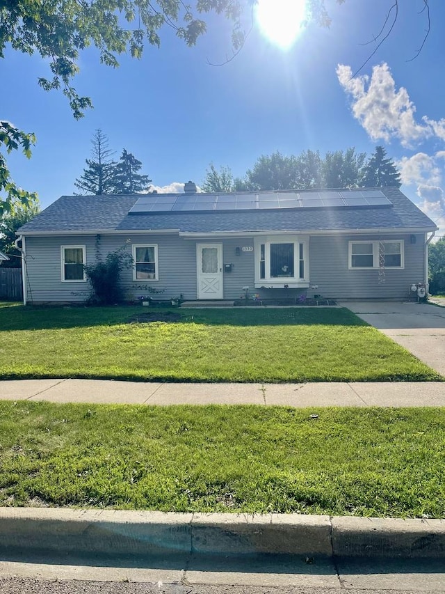 1350 N Elmwood Dr, Aurora, IL 60506 - ranch-style house with solar panels and a front yard