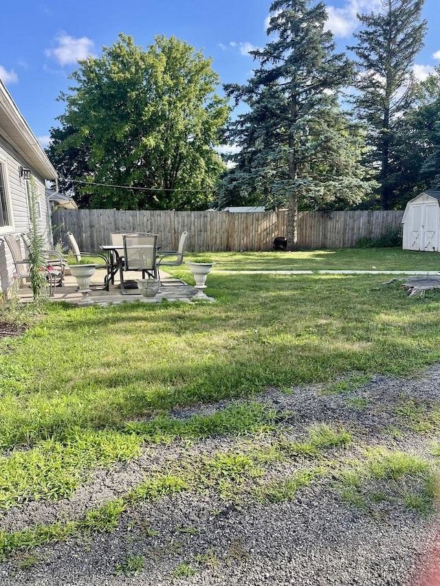 1350 N Elmwood Dr, Aurora, IL 60506 - fenced backyard with a storage shed and a patio area