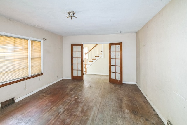 907 W Beardsley Ave, Champaign, IL 61821 - unfurnished room with french doors, hardwood / wood-style floors, and stairs