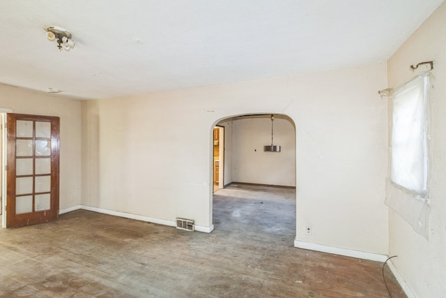 907 W Beardsley Ave, Champaign, IL 61821 - empty room with arched walkways and baseboards