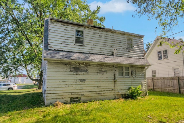 907 W Beardsley Ave, Champaign, IL 61821 - rear view of house featuring a chimney and roof with shingles