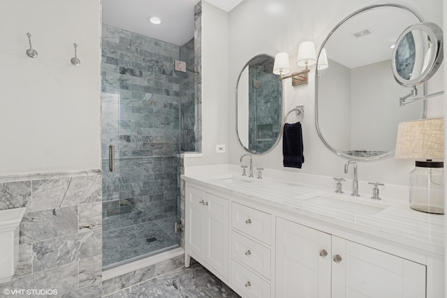 369 W Superior St Unit A, Chicago, IL 60654 - bathroom featuring a shower stall, double vanity, marble finish floors, and recessed lighting