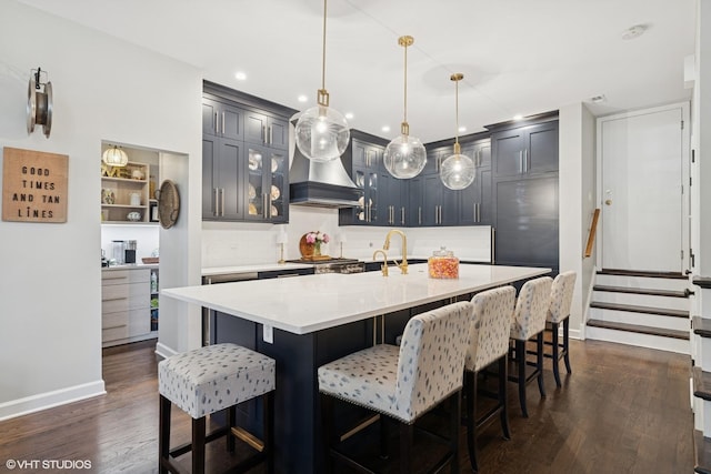 369 W Superior St Unit A, Chicago, IL 60654 - kitchen featuring tasteful backsplash, dark wood finished floors, a kitchen bar, pendant lighting, and recessed lighting