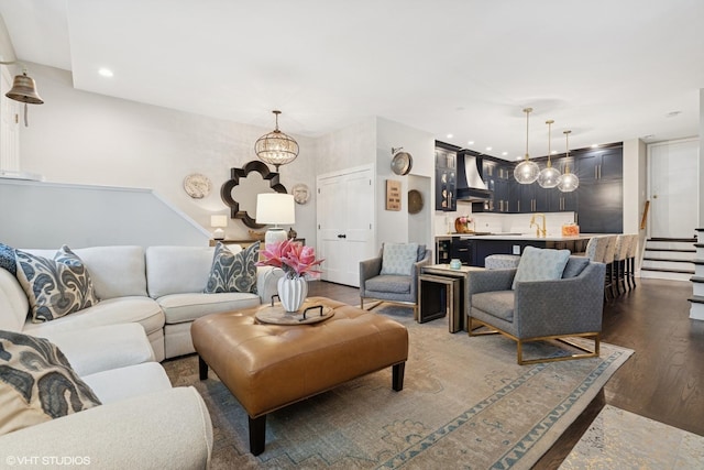 369 W Superior St Unit A, Chicago, IL 60654 - living room featuring wood finished floors, bar area, recessed lighting, a chandelier, and stairway