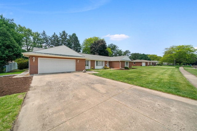 212 Forsythe Ln, Dekalb, IL 60115 - single story home featuring an attached garage, concrete driveway, brick siding, and a front yard