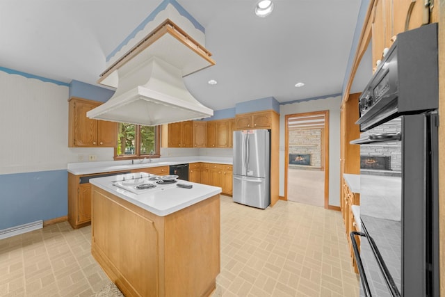 212 Forsythe Ln, Dekalb, IL 60115 - kitchen featuring black appliances, light countertops, a fireplace, a kitchen island, and custom exhaust hood