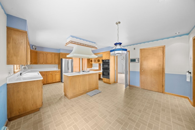 212 Forsythe Ln, Dekalb, IL 60115 - kitchen with brick patterned floors, freestanding refrigerator, light countertops, and a center island