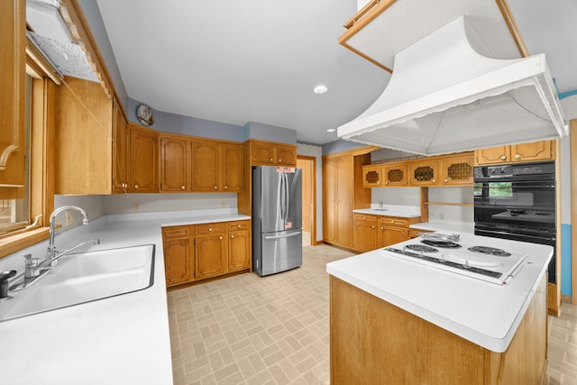 212 Forsythe Ln, Dekalb, IL 60115 - kitchen featuring freestanding refrigerator, cooktop, custom range hood, brick patterned flooring, and light countertops