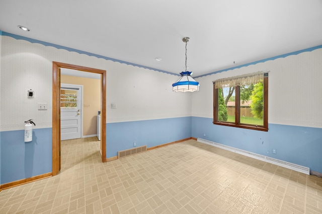 212 Forsythe Ln, Dekalb, IL 60115 - spare room featuring baseboards and baseboard heating