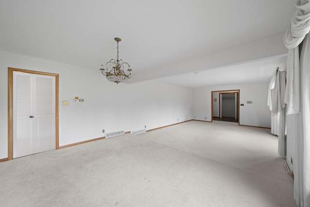 212 Forsythe Ln, Dekalb, IL 60115 - unfurnished room featuring carpet and a chandelier