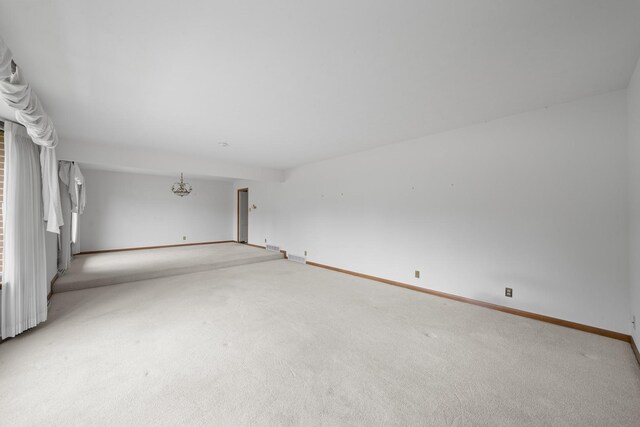 212 Forsythe Ln, Dekalb, IL 60115 - unfurnished room featuring light carpet and baseboards