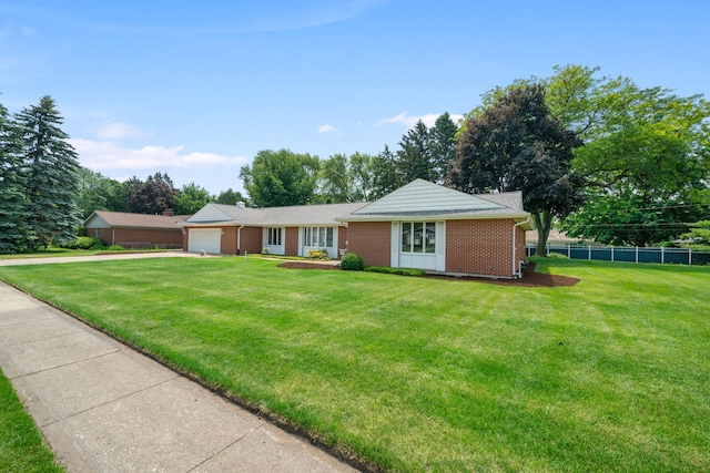212 Forsythe Ln, Dekalb, IL 60115 - single story home with an attached garage, brick siding, and concrete driveway