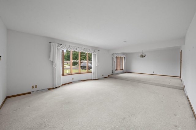 212 Forsythe Ln, Dekalb, IL 60115 - empty room featuring carpet flooring and a chandelier