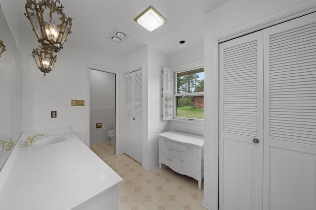 212 Forsythe Ln, Dekalb, IL 60115 - bathroom with a closet, vanity, and tile patterned floors